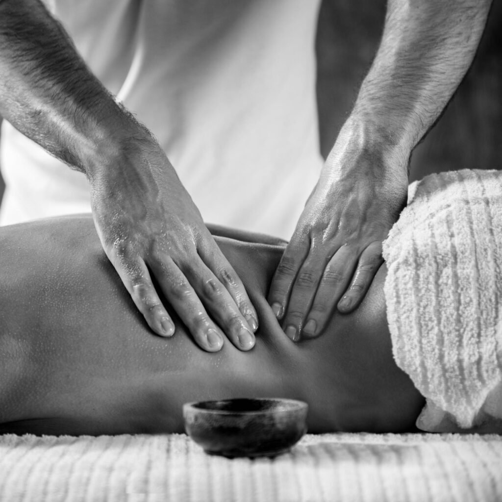 Deep tissue back massage, black and white